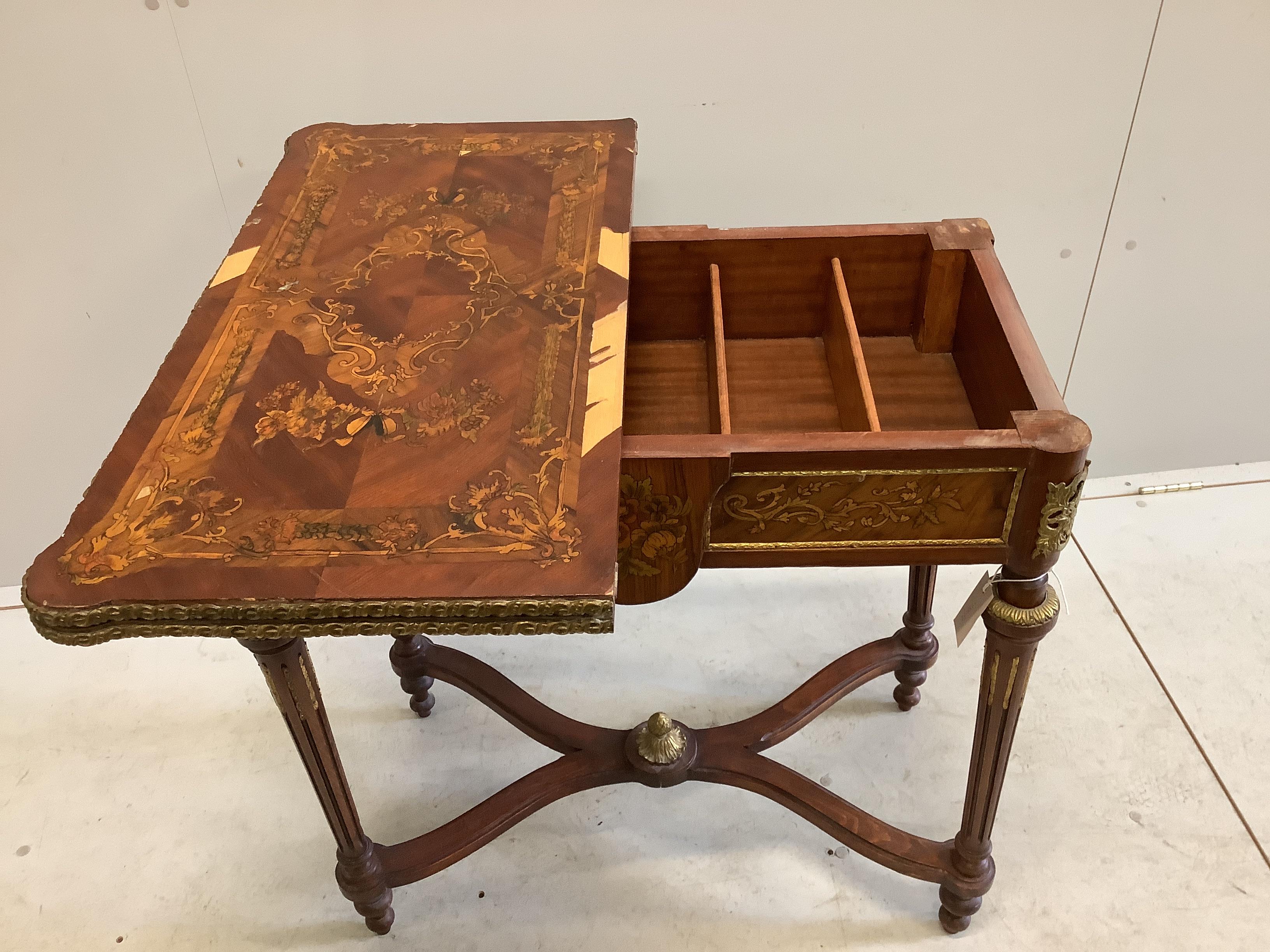A Louis XVI style gilt metal mounted and marquetry inlaid folding card table, width 77cm, depth 40cm, height 78cm